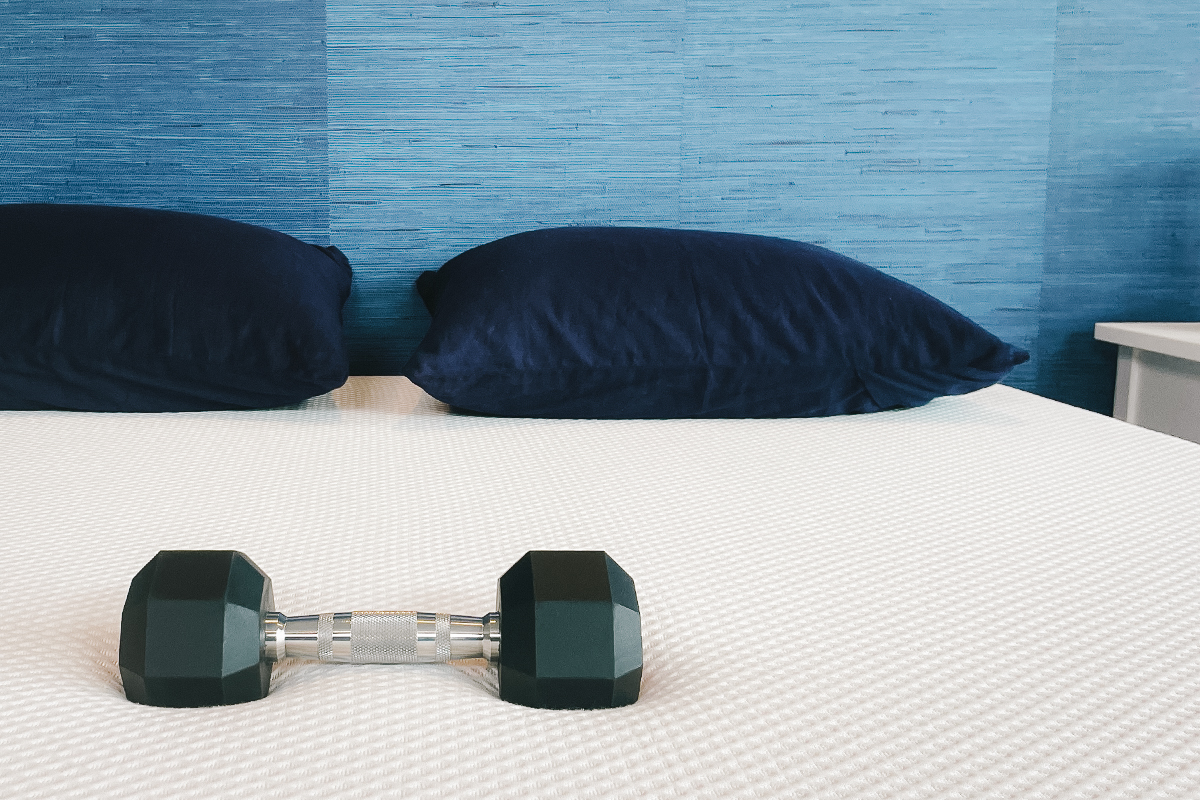 A 10-pound dumbbell on the Nectar Memory Foam mattress.