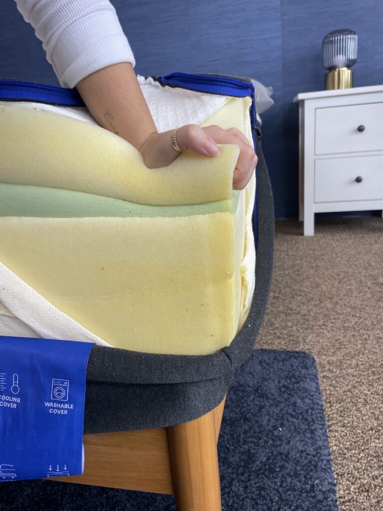 Our tester reveals the three foam layers of the Nectar Original inside the cover